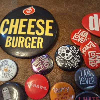 various buttons or pins
