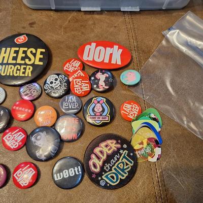 various buttons or pins