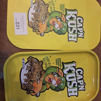 metal tray and magnetic mat of Cap'n Kuch with images of cannabis on it