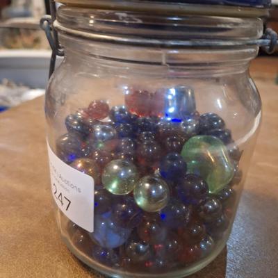 glass jar of glass beads and marbles