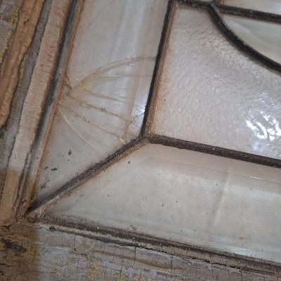 Decorative glass window or glass that was above a door. It has some damage, please see all photos