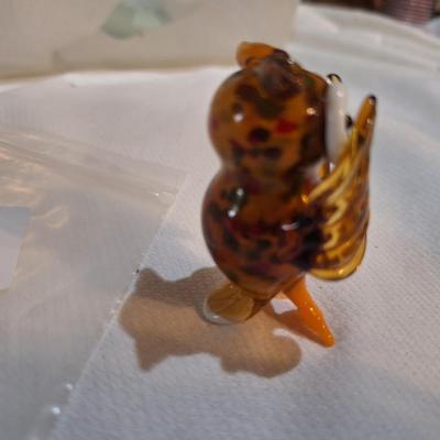 miniature blown glass owl with wings covering eyes