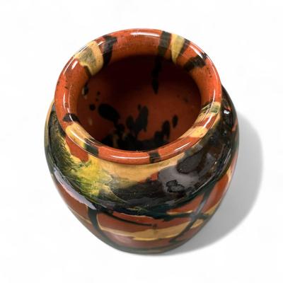 Sale Photo Thumbnail #1056: Peters and Reed Marbleized Pattern Vase.  This vase features a marbleized pattern with hues of terra cotta, moss green, black and yellow.  Approximately 98" tall, 3' base, and 3.25 " opening