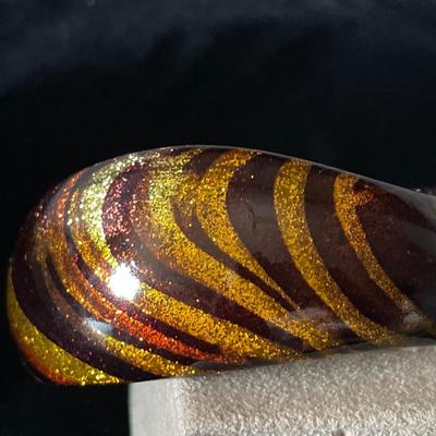 Stunning gold, orange, brown swirl Bakelite bracelet