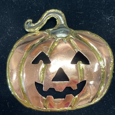 Copper pumpkin and small brooches