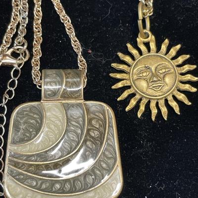 4 gold tone pendants