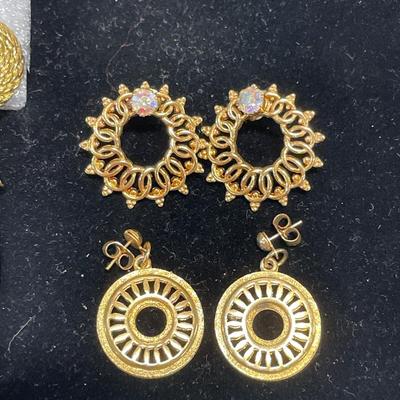 Gold tone and long crystal earrings with more