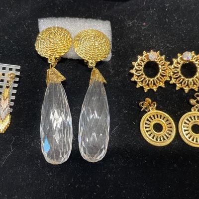 Gold tone and long crystal earrings with more