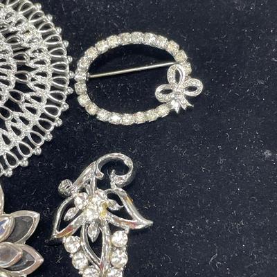 6 silver tone brooches and pins