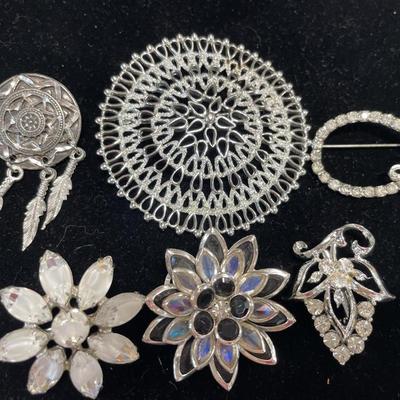 6 silver tone brooches and pins