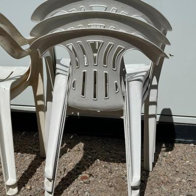 5 PLASTIC STACKING CHAIRS