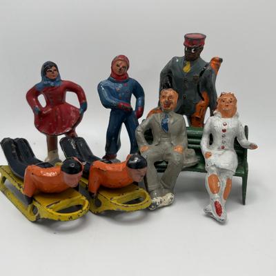 Lot 244: Vintage Barclay Manoil Lead Winter Figurines & Train Porter