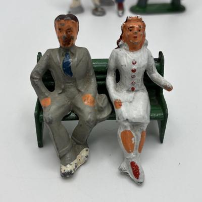 Lot 244: Vintage Barclay Manoil Lead Winter Figurines & Train Porter