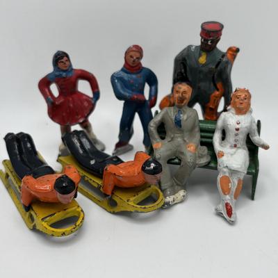 Lot 244: Vintage Barclay Manoil Lead Winter Figurines & Train Porter