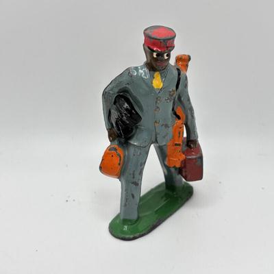 Lot 244: Vintage Barclay Manoil Lead Winter Figurines & Train Porter