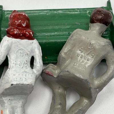Lot 244: Vintage Barclay Manoil Lead Winter Figurines & Train Porter