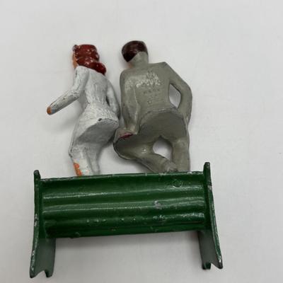 Lot 244: Vintage Barclay Manoil Lead Winter Figurines & Train Porter