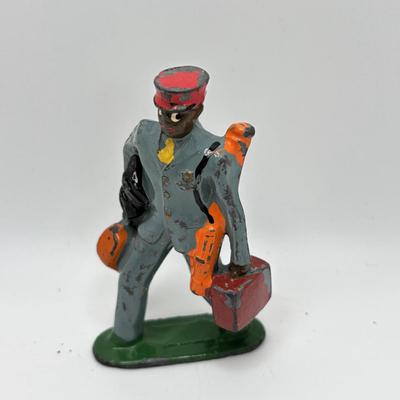 Lot 244: Vintage Barclay Manoil Lead Winter Figurines & Train Porter