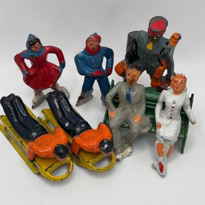 Lot 244: Vintage Barclay Manoil Lead Winter Figurines & Train Porter