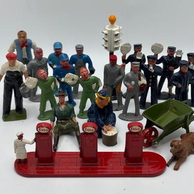LOT 245: Lesney Esso Gas Pump, Britains Farm Figurines, Barclay Newspaper Seller & More
