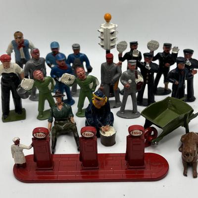 LOT 245: Lesney Esso Gas Pump, Britains Farm Figurines, Barclay Newspaper Seller & More