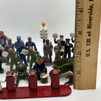LOT 245: Lesney Esso Gas Pump, Britains Farm Figurines, Barclay Newspaper Seller & More
