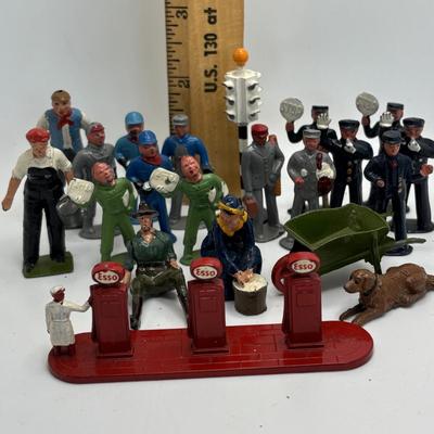 LOT 245: Lesney Esso Gas Pump, Britains Farm Figurines, Barclay Newspaper Seller & More