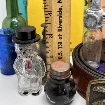 LOT 248: America Remembered 1985 Park City Belt Buckle, Pin Striping Tool, Glass Dog Perfume Bottle & More