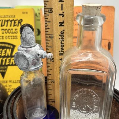 LOT 248: America Remembered 1985 Park City Belt Buckle, Pin Striping Tool, Glass Dog Perfume Bottle & More