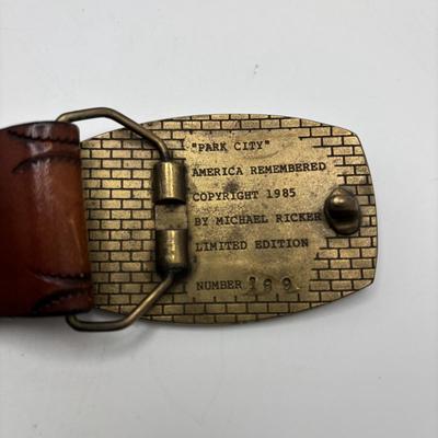 LOT 248: America Remembered 1985 Park City Belt Buckle, Pin Striping Tool, Glass Dog Perfume Bottle & More