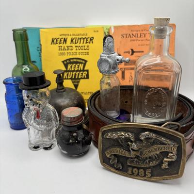 LOT 248: America Remembered 1985 Park City Belt Buckle, Pin Striping Tool, Glass Dog Perfume Bottle & More