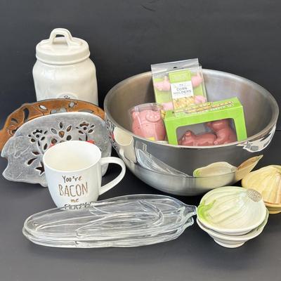 LOT 262: Hoffritz Stainless Steel Bowl, Pig Trivets, Corn on the Cob Dishes, Pig Corn Holders, Rae & Dunn Storage Jar,...