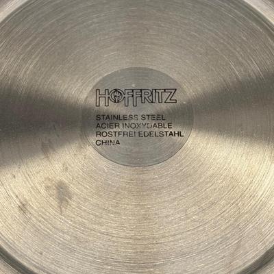LOT 262: Hoffritz Stainless Steel Bowl, Pig Trivets, Corn on the Cob Dishes, Pig Corn Holders, Rae & Dunn Storage Jar,...
