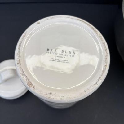 LOT 262: Hoffritz Stainless Steel Bowl, Pig Trivets, Corn on the Cob Dishes, Pig Corn Holders, Rae & Dunn Storage Jar,...