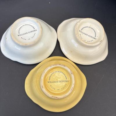 LOT 262: Hoffritz Stainless Steel Bowl, Pig Trivets, Corn on the Cob Dishes, Pig Corn Holders, Rae & Dunn Storage Jar,...