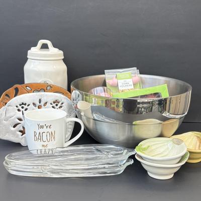 LOT 262: Hoffritz Stainless Steel Bowl, Pig Trivets, Corn on the Cob Dishes, Pig Corn Holders, Rae & Dunn Storage Jar,...