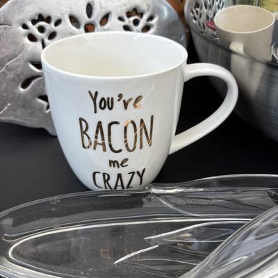 LOT 262: Hoffritz Stainless Steel Bowl, Pig Trivets, Corn on the Cob Dishes, Pig Corn Holders, Rae & Dunn Storage Jar,...