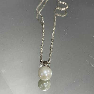 Pearl and shell pendants on sterling chains