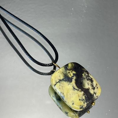 Hand carved African couple with interesting stone necklace