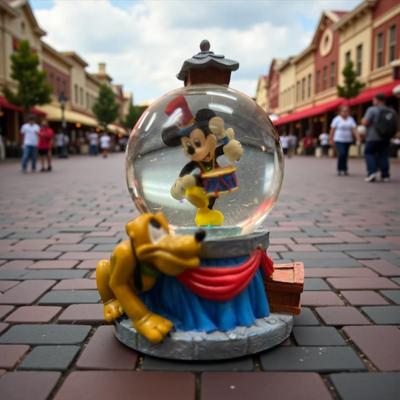 Sale Photo Thumbnail #92: Walt Disney Mickey Mouse drumming with Pluto Mini Snow Globe
Approximately 3.25" tall