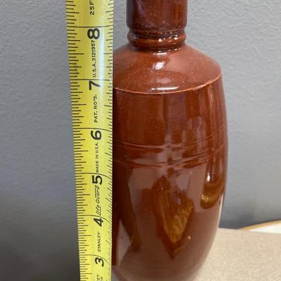 Brown stoneware vase and silver plate spoons