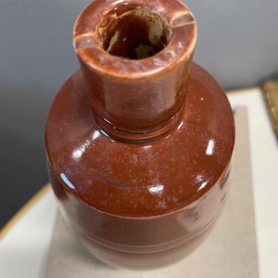Brown stoneware vase and silver plate spoons