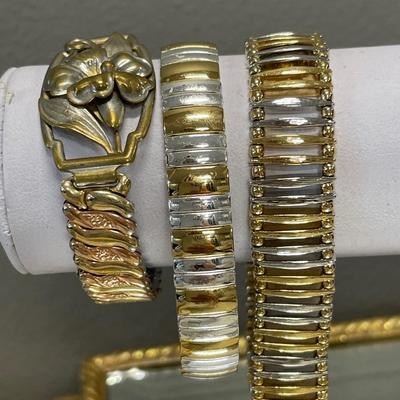 3 stretch gold and silver tone bracelets