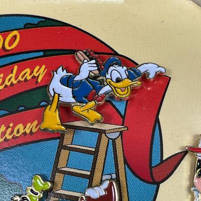 Sale Photo Thumbnail #124: Walt Disney World 2000 Cast Holiday Celebration Pin Set Includes 5 Pins in Wooden Box  Includes Dumbo, Donald Duck, Goofy, Mickey Mouse and Pluto, and Timothy Mouse