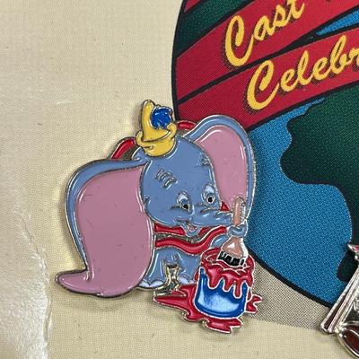 Sale Photo Thumbnail #122: Walt Disney World 2000 Cast Holiday Celebration Pin Set Includes 5 Pins in Wooden Box  Includes Dumbo, Donald Duck, Goofy, Mickey Mouse and Pluto, and Timothy Mouse