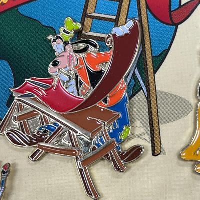 Sale Photo Thumbnail #123: Walt Disney World 2000 Cast Holiday Celebration Pin Set Includes 5 Pins in Wooden Box  Includes Dumbo, Donald Duck, Goofy, Mickey Mouse and Pluto, and Timothy Mouse