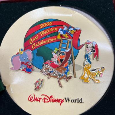 Sale Photo Thumbnail #126: Walt Disney World 2000 Cast Holiday Celebration Pin Set Includes 5 Pins in Wooden Box  Includes Dumbo, Donald Duck, Goofy, Mickey Mouse and Pluto, and Timothy Mouse