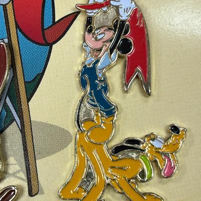 Sale Photo Thumbnail #125: Walt Disney World 2000 Cast Holiday Celebration Pin Set Includes 5 Pins in Wooden Box  Includes Dumbo, Donald Duck, Goofy, Mickey Mouse and Pluto, and Timothy Mouse