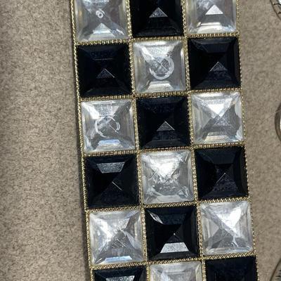 Large pendant necklaces and black and clear checkered brooch