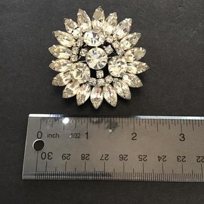 Sale Photo Thumbnail #42: Beautiful Silvertone flower blossom clear rhinestone brooch. Please see attached photos.